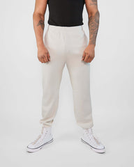 Model wearing HyperCool sweatpants in bright color, featuring a straight leg design and casual sneakers.