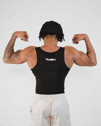 Man flexing muscles in a tight-fit black Atlas Tank made from breathable bamboo viscose.